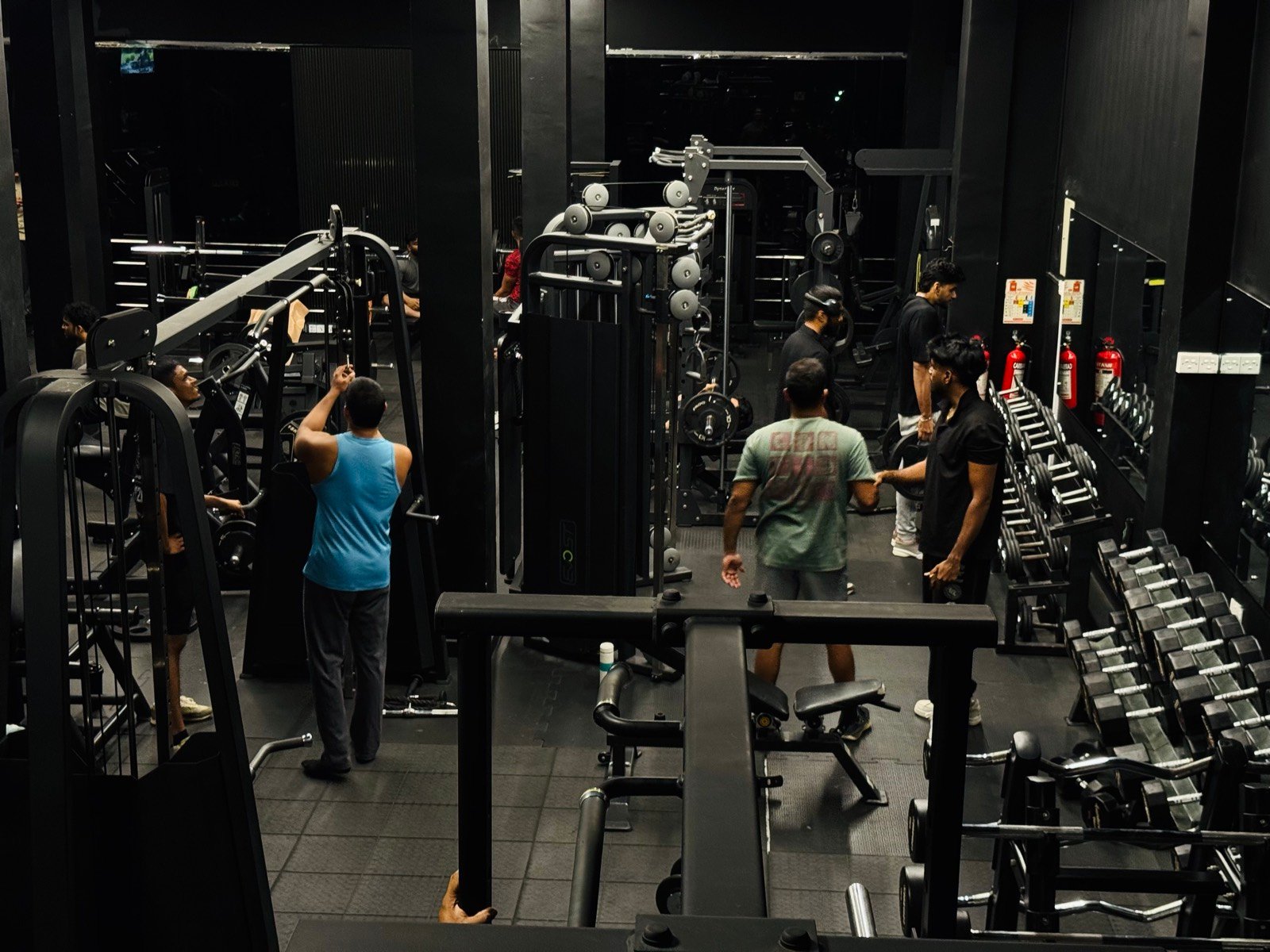Squat racks, cable towers and benches on the Premium Fitness floor